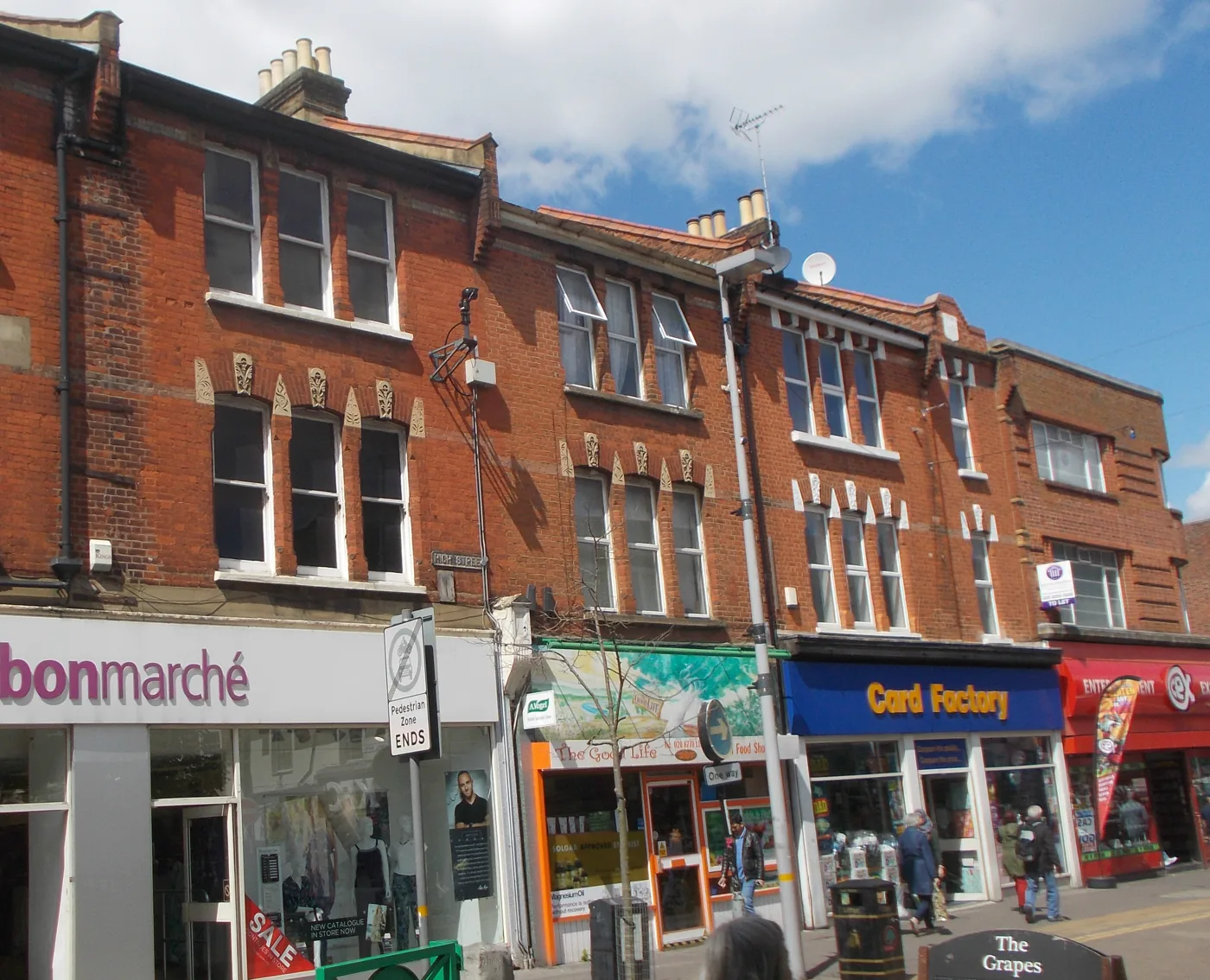 Shops on Sutton High Street beside The Grapes, the locally listed pub immediately south of the former Argos site. The building in this story is not pictured.