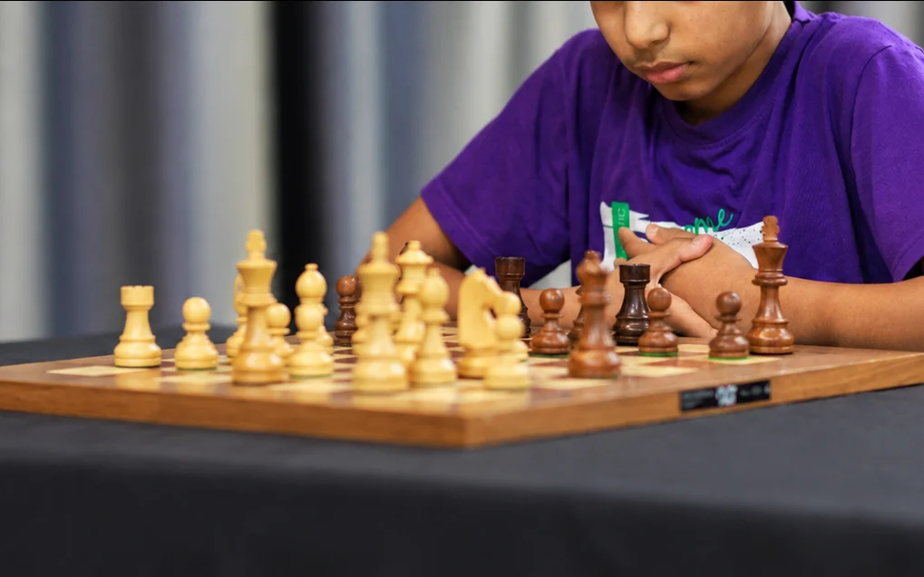 Supratit Banerjee at the chessboard, from Sutton Grammar School's announcement of his title.