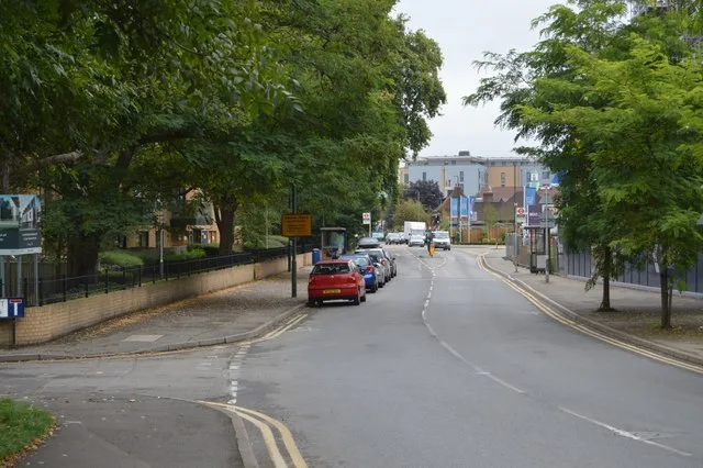 Hackbridge Road, the B277, in 2017. One of the two houses is on the corner of Hackbridge Road and Elm Road.